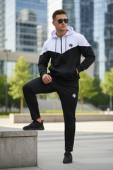 Full body athletic pose with foot on ledge