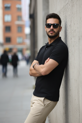 Model leaning with arms crossed