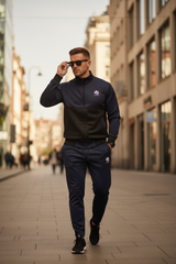Model standing straight adjusting sunglasses